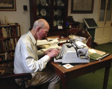 Regimental Historian Major Hugo White typing up research.