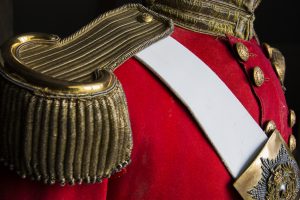 A uniform displaying the epaulette's and breast plate