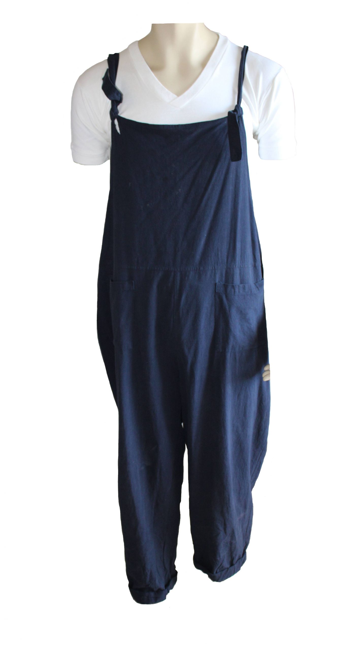 Dark blue dungarees over a white t-shirt