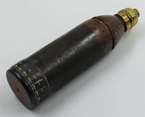 Field artillery shell with rounded top.