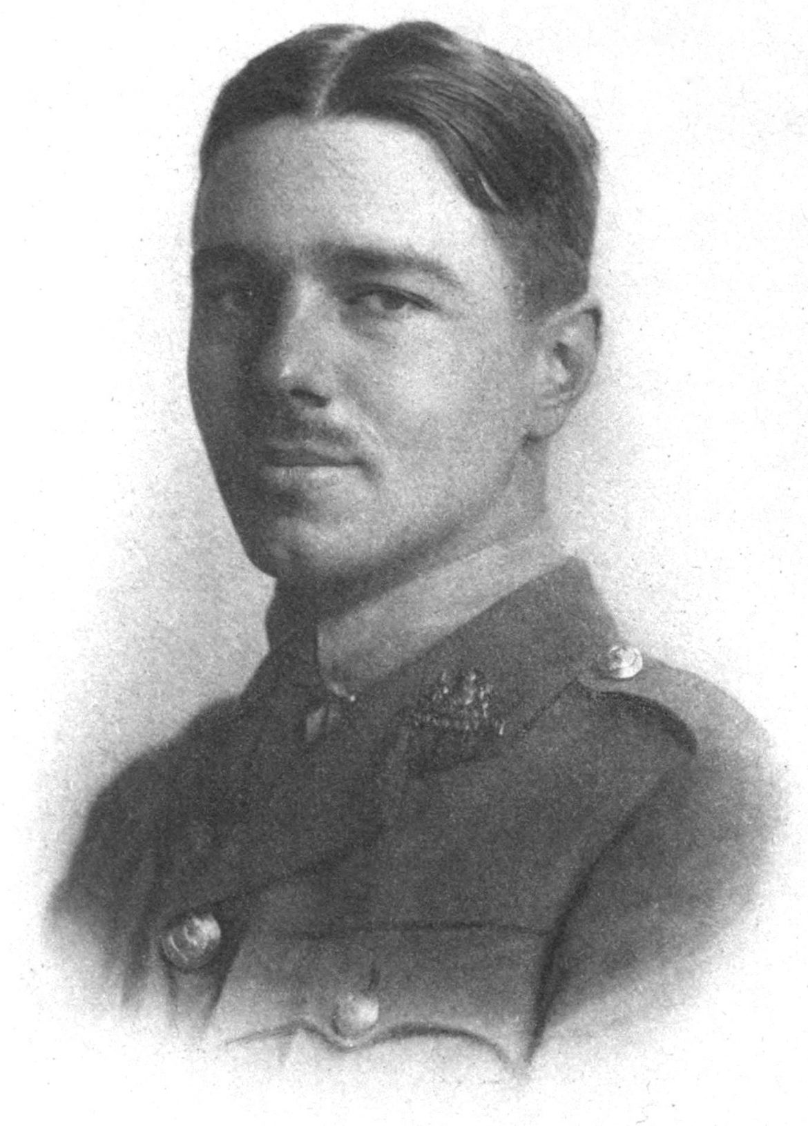 Black and white photograph of Wilfred Owen wearing military uniform.