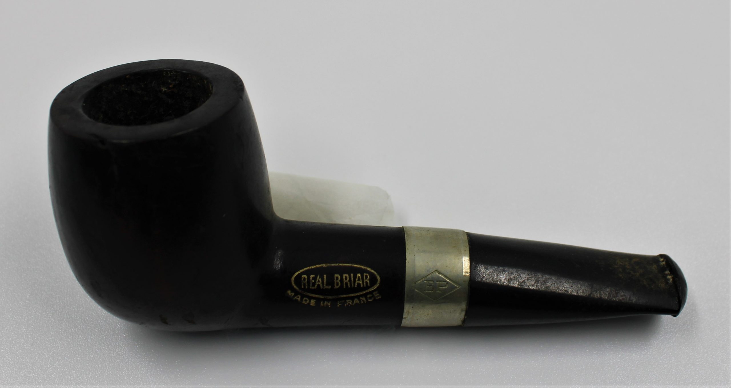 Black tobacco pipe.