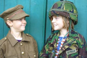 two Boys dressed in soldier uniform