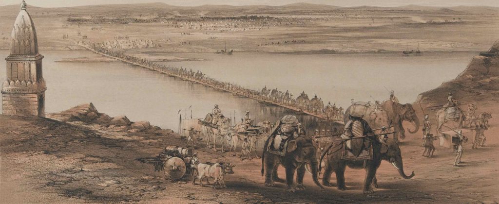 Series of wagons, carts, and elephants crossing a river on a bridge